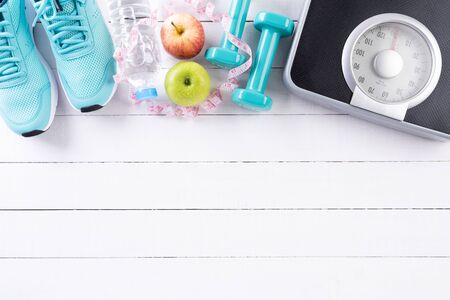 Healthy lifestyle, food and sport concept. Top view of athlete's equipment Weight Scale measuring...