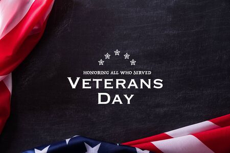 Happy Veterans Day. American flags veterans against a blackboard background.の写真素材