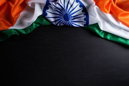 Indian republic day concept. Indian flag with the text Happy republic day against a blackboard...