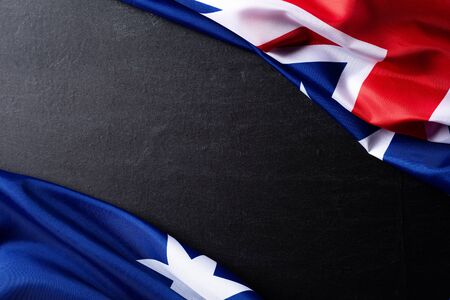 Australia day concept. Australian flag with the text Happy Australia day against a blackboard background. 26 January.の写真素材