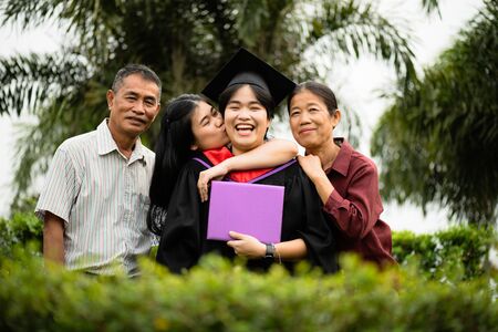 Graduation ceremony. Parents and family congratulate the student, who finish their studies at the university.の写真素材