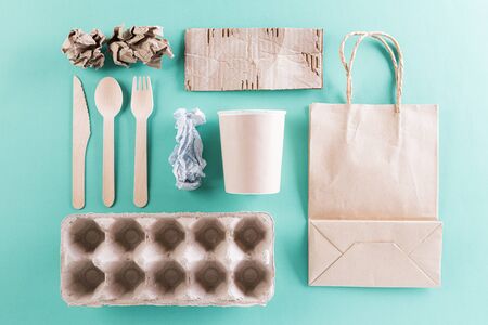 Top view of different paper garbage materials on green pastel background. Recycle, World Environment Day, go green and Eco conceptの写真素材