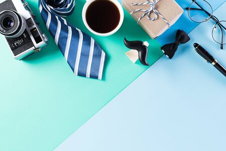 Happy Fathers Day background concept with coffee cup, decorated bowtie, necktie, eyeglasses, gift...