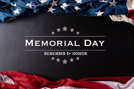 Happy Memorial Day. American flags with the text REMEMBER & HONOR against a black  background.の写真素材