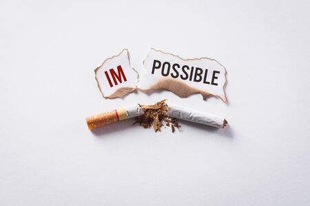 World No Tobacco Day concept, May 31. Quitting smoking or No smoking sign made with broken cigarettes on white background.の写真素材
