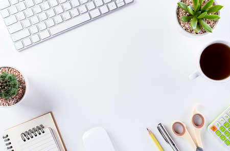 Flat lay, top view office table desk. Workspace with keyboard, office supplies, pencil and coffee...