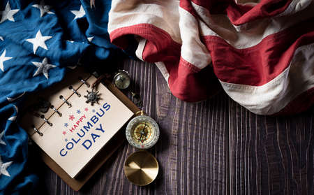 Happy Columbus Day concept. Vintage American flag with compass and treasure manuscript with text:...