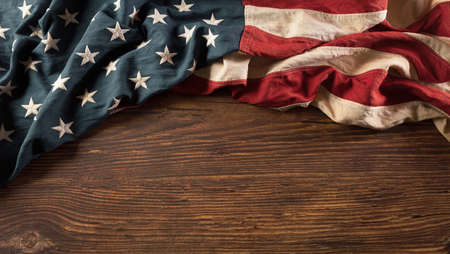 Happy Veterans Day concept. Vintage American flags against old wooden  background. November 11.