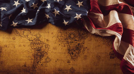 Happy Columbus Day concept. Vintage American flag over retro treasure manuscript.  Flat lay, top...