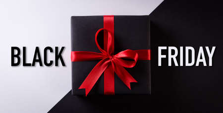 Top view of black christmas boxes on black and white background Black Friday composition concept.