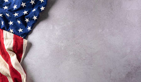 Happy Veterans Day concept. American flags against gray stone  background. November 11.の写真素材