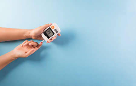 World diabetes day awareness concept. The diabetic measures the level of glucose in the blood, 14...