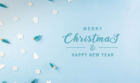 Christmas pattern made of snowflake, stars and christmas tree on pastel blue background. Winter...