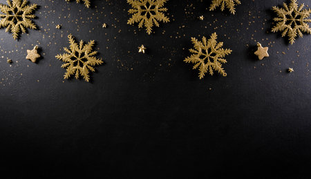 Christmas and new year background concept. Top view of Christmas snowflake and stars on black wooden background.の写真素材