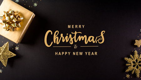Christmas and new year background concept. Top view of Christmas gift box, star, christmas ball and snowflake on black wooden background.の写真素材