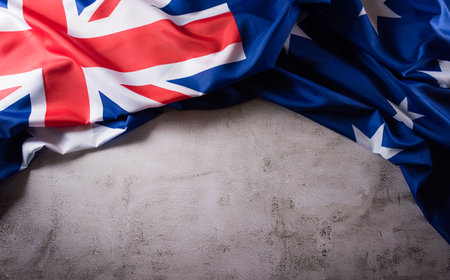 Happy Australia day concept. Australian flag against old stone background. 26 January.の写真素材