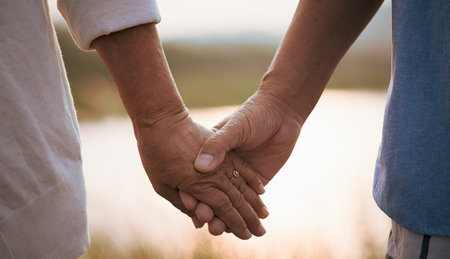 Love and Valentine day concept. A happy senior couple holding hand  during sunset , Senior...