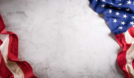 Happy presidents day concept with flag of the United States on old stone background.