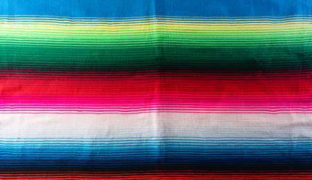 Cinco de mayo background decorated image made from mexican blanket stripes or poncho serape background.の写真素材