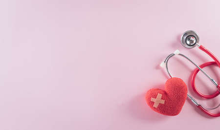 Top view of doctor stethoscope and red heart on pastel background. World health day and medical concept.の写真素材