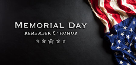 Happy memorial day concept made from american flag with text on black wooden background.の写真素材