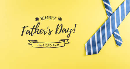 Happy Father's Day background concept made from beautiful tie on pastel yellow background.の写真素材