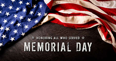 Happy memorial day concept made from american flag with text over dark stone background.の写真素材