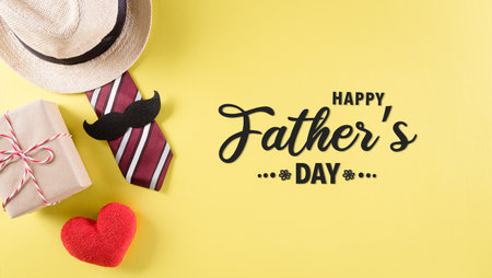 Happy Father's Day background concept with tie and  mustache, hat, gift box, red heart  with the text on pastel yellow background.の写真素材