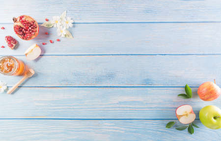 Rosh hashanah (jewish New Year holiday), Concept of traditional or religion symbols on pastel blue wooden background.の写真素材