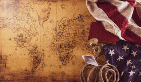 Happy Columbus Day concept. Vintage American flag, compass, paper boat, rope on retro treasure...