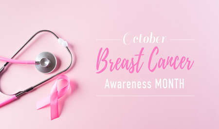 Pink ribbon and stethoscope on pastel pink background, Symbol of womens breast cancer awareness, Health care and medical concept.の写真素材