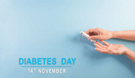 World diabetes day awareness concept. The diabetic measures the level of glucose in the blood, 14 November.の写真素材