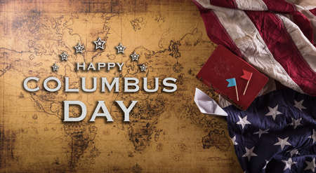 Happy Columbus Day concept. Vintage American flag, compass, paper boat, rope on retro treasure manuscript.の写真素材