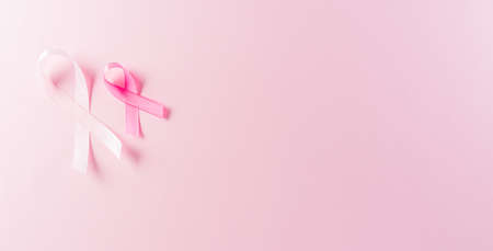 Pink ribbons on pastel background, Symbol of women's breast cancer awareness, Health care and medical concept.の写真素材