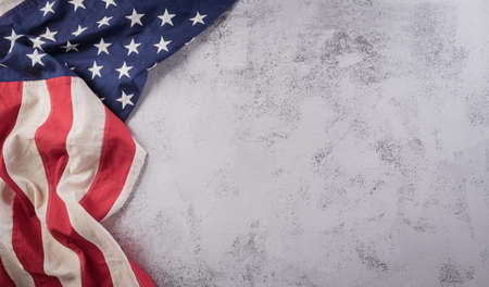 Happy Veterans Day concept. American flags against a dark stone  background. November 11.の写真素材