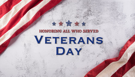 Happy Veterans Day concept. American flags against a dark stone  background. November 11.の写真素材
