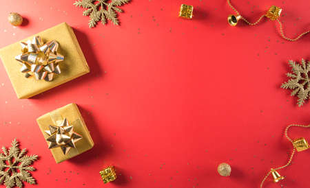 Online shopping of China, 11.11 singles day sale concept. Top view of golden christmas gift boxes with ribbon on red background with copy space.の写真素材