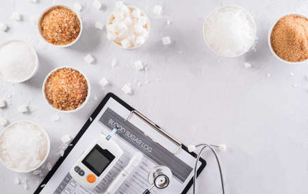 World diabetes day awareness concept. The diabetes measure set and different kind of sugar, a symbol of diabetic control in the blood, 14 November.の写真素材