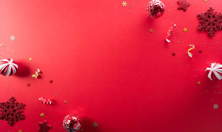 Christmas and new year background concept. Top view of Christmas  ball and snowflake on red background.の写真素材