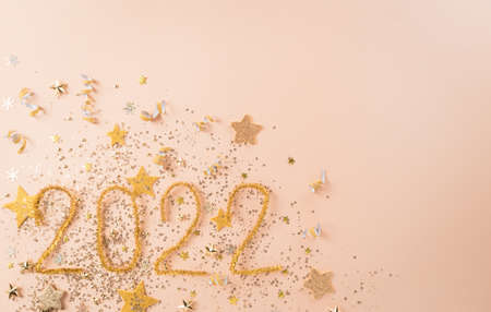 Happy new year celebration background concept made from golden christmas ball and star on pastel background.の写真素材
