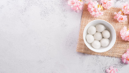 Top view of Tang Yuan(sweet dumplings balls) on stone background. Traditional cuisine for lantern festival, Mid-autumn, Dongzhi (winter solstice festival) and Chinese new year.の写真素材