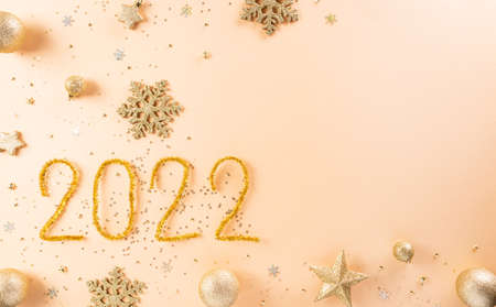 Happy new year celebration background concept made from golden christmas ball and star on pastel background.の写真素材