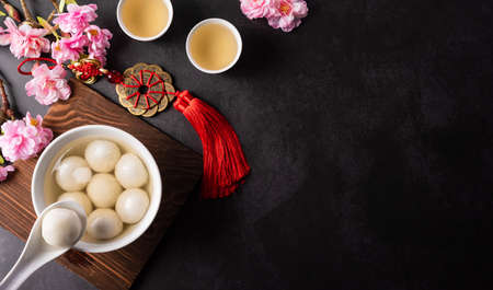 Tang Yuan(sweet dumplings balls), a traditional cuisine for Mid-autumn, Dongzhi (winter solstice ) and Chinese new year. Chinese characters FU in the article refer to fortune, wealth, money flow.の写真素材