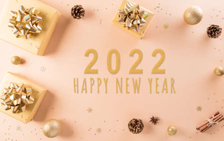 Merry christmas and happy new year celebration background concept. Golden gift box, stars and christmas ball on pastel background.の写真素材