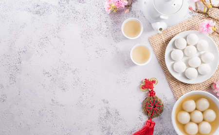 Top view of Tang Yuan(sweet dumplings balls) on stone background. Traditional cuisine for lantern festival, Mid-autumn, Dongzhi (winter solstice festival) and Chinese new year.の写真素材