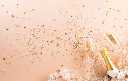 Happy new year celebration background concept made from champagne and glasses on pastel background.の写真素材