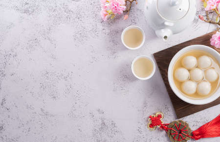 Top view of Tang Yuan(sweet dumplings balls) on stone background. Traditional cuisine for lantern festival, Mid-autumn, Dongzhi (winter solstice festival) and Chinese new year.の写真素材