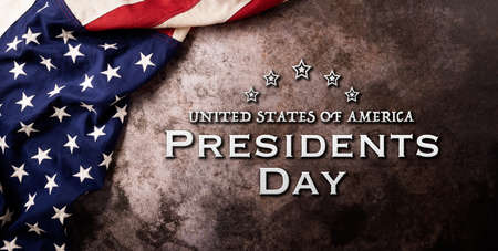 Happy presidents day concept with flag of the United States on dark stone background.の写真素材