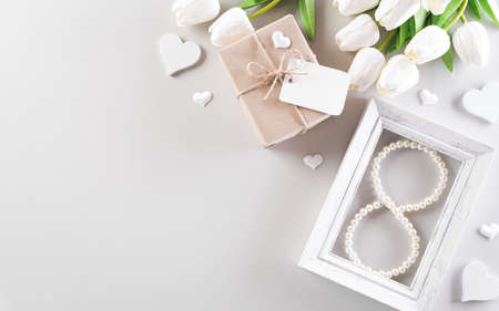 Happy women's day decoration concept, Beautiful tulips with gift box and picture frame on pastel background.の写真素材