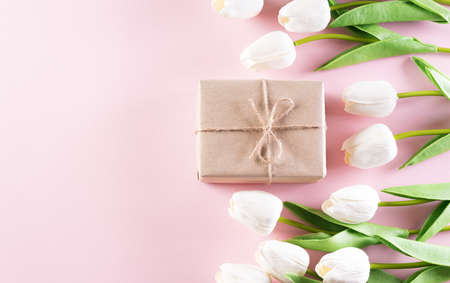 Happy women's day decoration concept, Beautiful tulips and gift box on pastel pink background.の写真素材